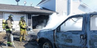 Truck destroyed by fire; garage also damaged