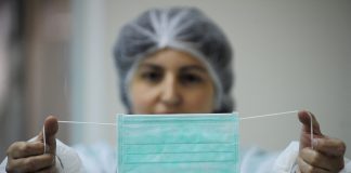 Local health care workers told to wear mask if not immunized