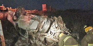 Car stuck on railway tracks is hit by train