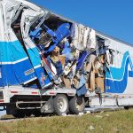Moving van side-swipes parked semi on Hwy. 1