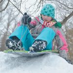 kid-playing-on-snow-pile
