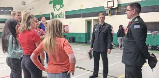 Soldiers discuss war and poppies with students