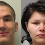 Four charged in armed robberies; two suspects still wanted by police