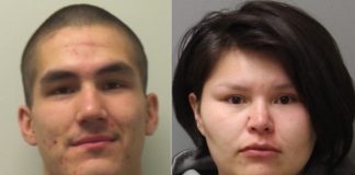 Four charged in armed robberies; two suspects still wanted by police
