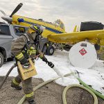 Truck collides with parked spray plane