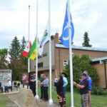 Flags raised in spirit of reconciliation