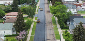 Road paving on schedule despite rainfall delays