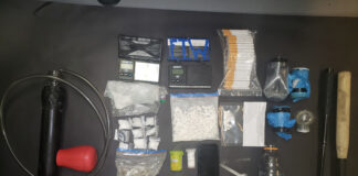 Two charged, illicit drugs seized after truck fails to slow to 60 km/hr while passing emergency vehicle