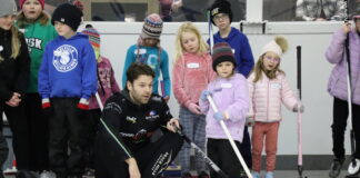 Walker/Muyres teach young curlers at clinic
