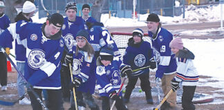 City hosts road hockey game between kids and Mils
