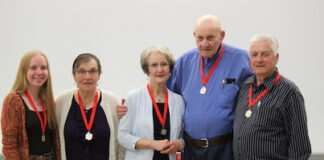 Five individuals receive Volunteer Service Medals