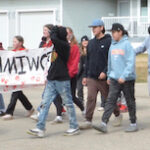 Students walk for missing women at Red Dress Day