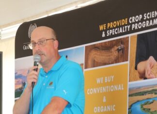 Grain Millers cuts cake at 25th anniversary celebration
